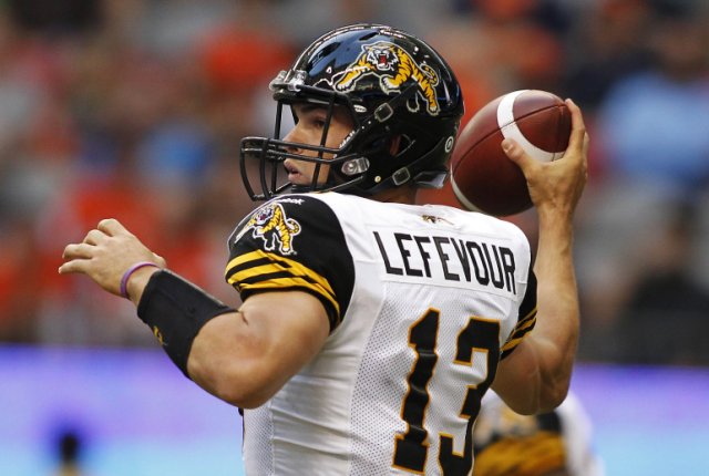 Hamilton Tiger-Cats' Dan LeFevour throws the ball against the B.C Lions during the first half of their CFL football game in Vancouver.